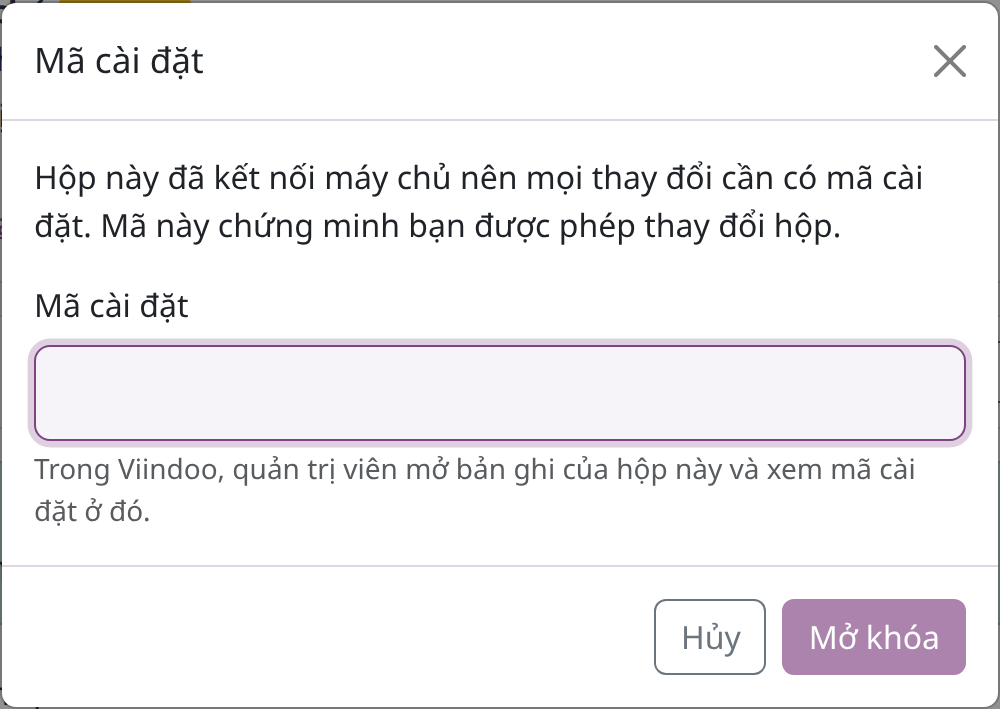 Hộp thoại Mã cài đặt của trang hộp với nút Mở khóa